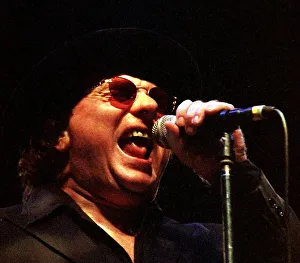 Rock singer Van Morrison hat glasses on stage June 1998