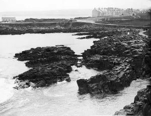 Rocks Prints: The rocky coastline near Portrush in County Londonderry Northern Ireland. 25th April 1928