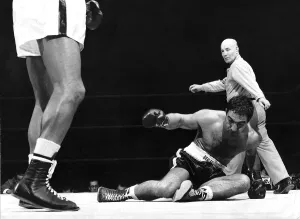 Rocky Marciano Boxer downed in the first round of his heavyweight title fight with Jersey