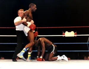 Rod Douglas is knocked down during a fight against Errol Graham at Wembley in 1989