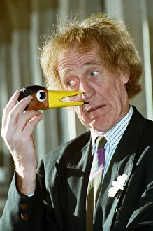 00349 Prints: Rod Hull seen here with a miniature head of his feathered partner Emu. 12th January 1993