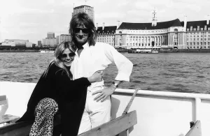 Rod Stewart singer with girlfriend Brit Ekland pose for a photograph during a boat trip