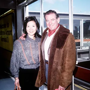 Sheepskin Prints: Rod Taylor and his wife Carol leave LAP for Los Angeles April 1985