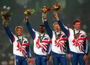 Roger Black of Great Britain celebrates with his teammates Mark Richardson