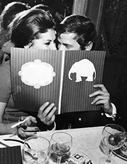 Eating Out Prints: Roger Moore Actor Luisa Mattiolli Actress and bride-to-be at The White Elephant Club
