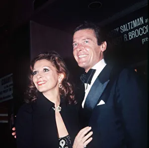Tuxedo Prints: Roger Moore Actor and his wife Luisa at the premiere of the film The Man With The Golden