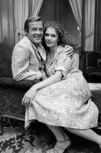 France Prints: Roger Moore with actress Lois Chiles at a photocall and reception held in Paris to