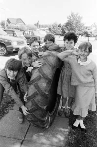 Roll em... Giving their giant tyre a last big push up these boys from Battyeford