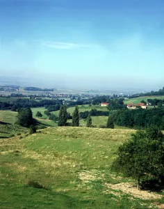 The rolling fertile plains of France studded with small farming villaged stretch for