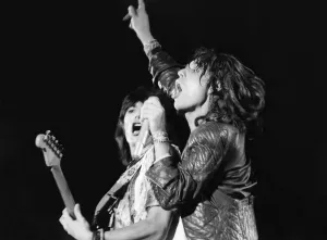 00043 Prints: Rolling Stone Mick Jagger socks it to em during the concert at Knebworth