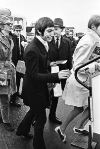 00373 Prints: The Rolling Stones band member Charlie Watts seen here at London Airport embarking on a