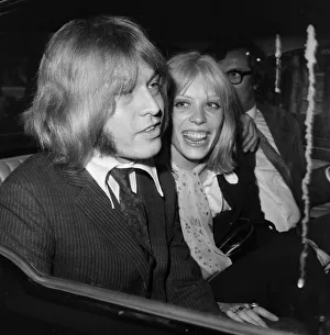 The Rolling Stones. Brian Jones hugs girlfriend Suki Potier outside court after Jones