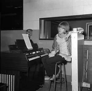 Rolling Stones: Brian Jones at Melotron keyboard sitting in the Olympic Recording Studio