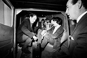 00324 Prints: The Rolling Stones bundled in a van outside Manchesters Piccadily Hotel