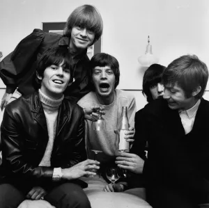 00144 Prints: Rolling Stones celebrate in their Manchester hotel after hearing news that their latest