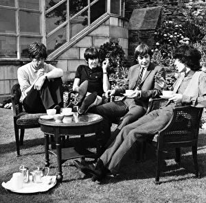 The Rolling Stones having a cup of tea in their hotel garden at Douglas