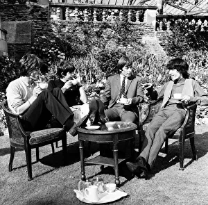 00427 Prints: The Rolling Stones having a cup of tea in their hotel garden at Douglas