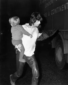 00292 Prints: Rolling Stones: Keith Richard backstage with his son Marlon March 1971