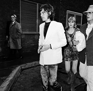 00324 Prints: Rolling Stones lead singer Mick Jagger arrives at London Heathrow Airport with Marianne