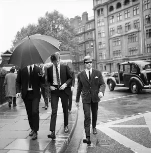 Rolling Stones: manager Andrew Loog Oldham and his chauffeur Reg Stiles (sunglasses