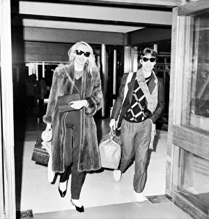 Caucasian Prints: Rolling Stones. Mick Jagger and Jerry Hall leaving London Airport Heathrow for a