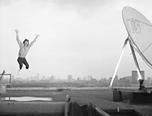 Arms Raised Prints: Rolling Stones: Mick Jagger on the roof of the Daily Mirror building in Holborn