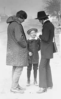Rolling Stones: Mick Jagger signs an autograph for a girl who also plays a part in Ned
