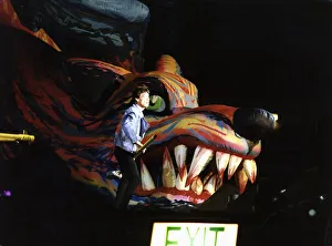 Rolling Stones: Mick Jagger on stage standing beside a Giant inflatable Dragons Head with