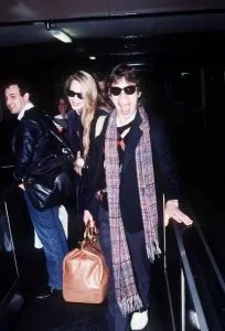 00046 Prints: Rolling Stones singer Mick Jagger at London Heathrow Airport with Jerry Hall before