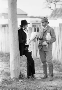 00100 Prints: Rolling Stones singer Mick Jagger relaxes by reading a newspaper as he talks to