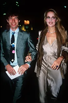 Rolling Stones singer Mick Jagger in suit and tie arriving Berkeley Square ball with