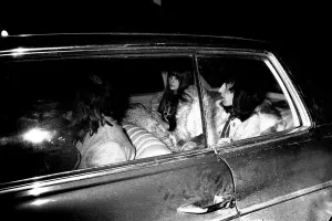 Rolling Stones Bill Wyman and his girlfriend Astrid leaving Newcastle station before