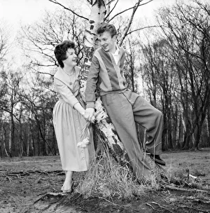 Romantic couple take a stroll in the country side. Richard Camp and Diane Ford. A651-003