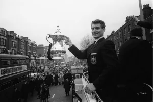 00240 Prints: Ron Henry holds the FA Cup on the open top bus May 1962 during the Tottenham