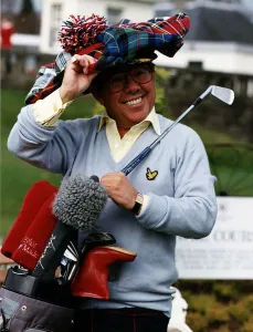 Ronnie Corbett television comedian with golf clubs and tartan cap