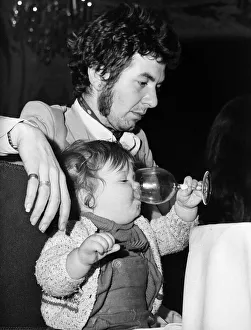Award Ceremonies Prints: Ronnie Lane of pop group The Faces formally Small Faces & daughter Alana 1973