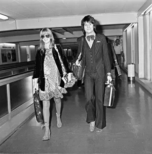 Ronnie Wood and his wife Krissy at Heathrow Airport for a holiday in Nassau