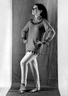 Hands On Hips Prints: Rosemary Bell modelling mini dress worn over slacks September 1965 P009447