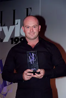 00138 Prints: Ross Kemp Actor September 98 Eastenders actor at the Elle Awards holding his award