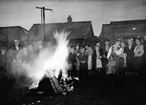 Bonfire Prints: Round the victory bonfire at Sproatley, East Yorkshire. 8th May 1945