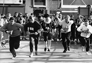 Frying Pan Prints: The Row and Flea Market Pancake Race around the stalls of the market in Birmingham City
