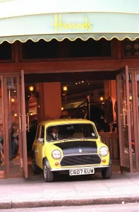 Rowan Atkinson Actor as Mr Bean filming at Harrods - motor cars mini