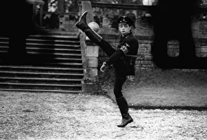 Quirky Prints: Rowan Atkinson does goose step as german officer 1982 A©mirrorpix