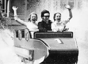 Roy Orbison American singer on a water chute at the Battersea Pleasure Gardens in London