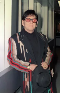 Roy Orbison at Heathrow Airport November 1988 in multi coloured coat