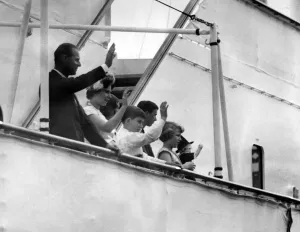 01036 Prints: The Royal family visit wales. The Royal party waves to the crowds as they sail
