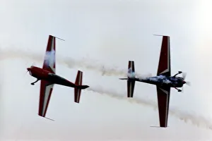 Aerobatics Prints: Royal Jordanian Falcons display team performing in their Extra EA300 aircraft