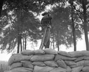 Binoculars Prints: Royal Marine from the Naval Brigade seen here manning a barricade made from sandbags