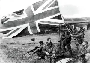 ROYAL MARINES RAISE UNION JACK OVER THE FALKLAND ISLANDS 1982