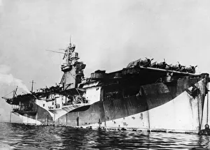 The Royal Navy escort carrier HMS Pursuer arrives at a British port during the Second